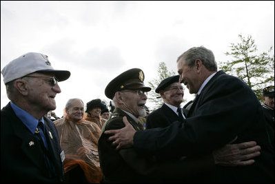 President George W. Bush greets veterans at the Netherlands American Cemetery in Margraten Sunday, May 8, 2005, following a ceremony honoring those who served in World War II.