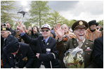 World War II veterans acknowledge President and Mrs. Bush Sunday, May 8, 2005, during a celebration at the Netherlands American Cemetery in Margraten, in remembrance of those who served during World War II.