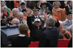 President George W. Bush and Mrs. Bush wave to a crowd at the American Cemetery in Margraten, Netherlands Sunday, May 8, 2005, honoring those who served in World War II 60 years ago.