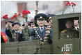 Veterans of Russia's military hold up flowers as they ride through Moscow's Red Square in a parade held to commemorate the 60th Anniversary of the end of World War II Monday, May 9, 2005.
