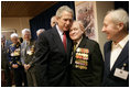 During a meeting with U.S. and Russian veterans, President George W. Bush hugs Russian veteran Vasik Ivanovich Korneer after he offered the President a coin from his service in Berlin during World War II in Moscow, Monday, May 9, 2005. President Bush asked that the veteran give the coin to a family member and thanked him for his courage.