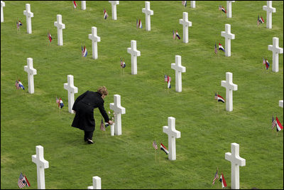 Mrs. Laura Bush lays flowers at the Netherlands American Cemetery Sunday, May 8, 2005, in Margraten.