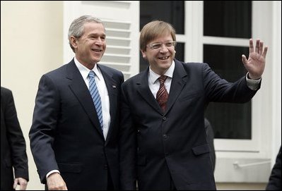 President George W. Bush and Belgian Prime Minister Guy Verhofstadt wave to the press outside the Prime Minister's office in Brussels, Belgium, Feb. 21, 2005. White House photo by Paul Morse