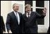 President George W. Bush and Belgian Prime Minister Guy Verhofstadt wave to the press outside the Prime Minister's office in Brussels, Belgium, Feb. 21, 2005.