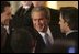 President George W. Bush greets fellow leaders and audience members during his address at Concert Noble Ballroom in Brussels, Belgium, Monday, Feb. 21, 2005. “In all these ways, our strong friendship is essential to peace and prosperity across the globe,” said the President in his speech.