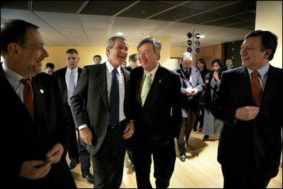 President George W. Bush laughs with, from left, European Union Council Secretariat Javier Solana, European Union President Jean-Claude Juncker and European Commission President Jose Manuel Barroso after a working dinner between the leaders in Brussels Tuesday, Feb. 22, 2005. 