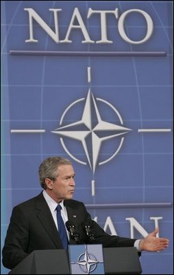 President George W. Bush speaks during a joint news conference with NATO Secretary General Jaap de Hoop Scheffer at NATO headquarters in Brussels Tuesday, Feb. 22, 2005. 