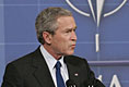 President George W. Bush speaks during a joint news conference with NATO Secretary General Jaap de Hoop Scheffer at NATO headquarters in Brussels Tuesday, Feb. 22, 2005. 