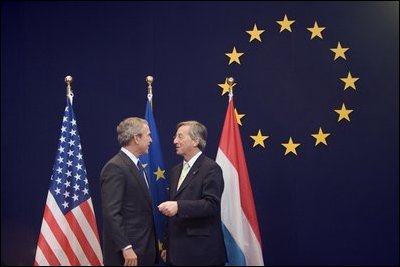 President George W. Bush meets with European Union President Jean-Claude Juncker while at the NATO Summit in Brussels Tuesday, Feb. 22, 2005.