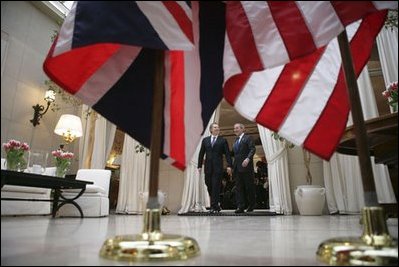 President George W. Bush and Prime Minister Tony Blair of the United Kingdom walk together after addressing the press at the Ambassador's Residence in Brussels, Belgium, Tuesday Feb. 22, 2005. 