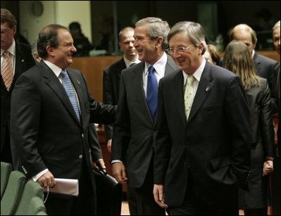 President George W. Bush laughs with Greek Prime Minister Costas Karamanlis, left, during a meeting at the European Union Council building in Brussels Tuesday, Feb. 22, 2005. 
