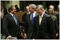 President George W. Bush laughs with Greek Prime Minister Costas Karamanlis, left, during a meeting at the European Union Council building in Brussels Tuesday, Feb. 22, 2005. 