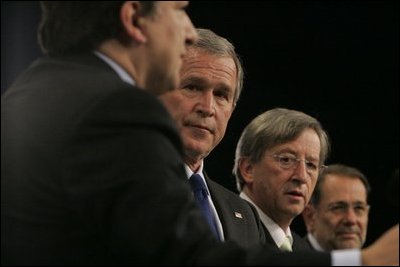 President George W. Bush stands with European Commission President Jose Manuel Barroso, left, European Union President Jean-Claude Juncker and European Union Council Secretariat Javier Solana, right, during a joint news conference Tuesday, Feb. 22, 2005, in Brussels.