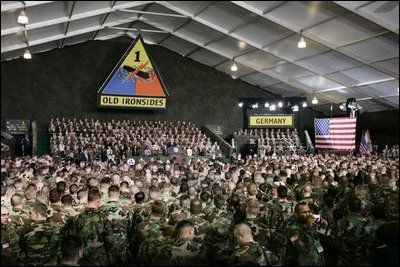 President Bush is nearly lost in a sea of camouflage as he addresses troops Wednesday, Feb. 24, 2005, at Wiesbaden Army Air Field in Wiesbaden, Germany.