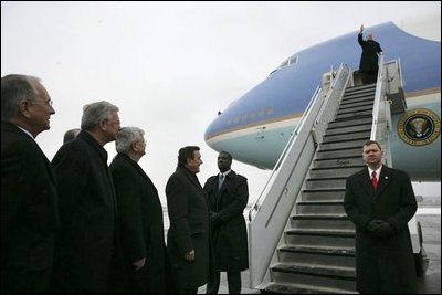 German Chancellor Gerhard Schroeder, fourth from left, and others wait on the tarmac as arriving U.S. President George W. Bush deplanes Air Force One at Rhein-Main Air Base in Frankfurt, Germany.