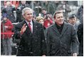 President George W. Bush and German Chancellor Gerhard Schroeder wave to the crowd during an official arrival ceremony at the Electoral Palace in Mainz, Germany, Wednesday, Feb. 23, 2005.