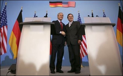 President George W. Bush shakes hands with German Chancellor Gerhard Schroeder during a Feb. 23, 2005, joint press conference at the Electoral Palace in Mainz, Germany.