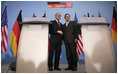 President George W. Bush shakes hands with German Chancellor Gerhard Schroeder during a Feb. 23, 2005, joint press conference at the Electoral Palace in Mainz, Germany.