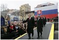 President George W. Bush gives his thumbs up as he leaves the stage with Prime Minister Mikulas Dzurinda of Slovakia after speaking at Hviezdoslavovo Square in Bratislava, Slovak Republic, Thursday, Feb. 24, 2005.