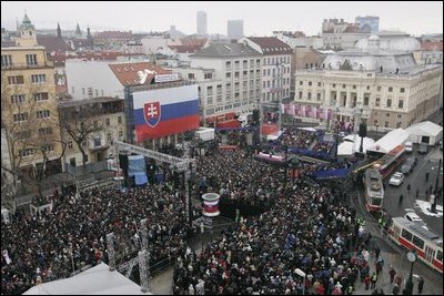 President George W. Bush and Slovakia.s Prime Minister Mikulas Dzurinda are greeted by a crowd of thousands gathered in Bratislava's Hviezdoslavovo Square, February 24, 2005.