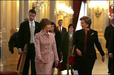 Laura Bush walks with Queen Paola of Belgium during a tour of the Royal Palace of Belgium in Brussels Monday, Feb. 21, 2005.