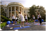 Led by White House trainer Trish Bearden, White House staffers demonstrate their near-infinite flexi bility.