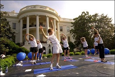 Led by White House trainer Trish Bearden, White House staffers demonstrate their near-infinite flexibility.