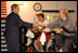 Accompanied by the Governor of Florida, his brother Jeb Bush, President George W. Bush visits senior citizens participating in an aerobic "spinning class" at the Marks street Senior Recreation Complex in Orlando, Fla., Friday, June 21, 2002.