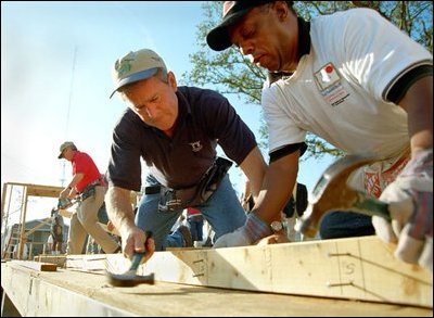 President George W. Bush works on a Habitat For Humanity house in Tampa, Fl., Tuesday, June 5, 2002. 