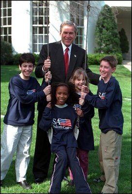 President George W. Bush meets with youth volunteers on the South Lawn of the White House. 