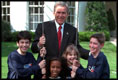 President George W. Bush meets with youth volunteers on the South Lawn of the White House. 