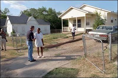 After helping build a house for Habitat for Humanity, President Bush meets some of his Waco neighbors. 