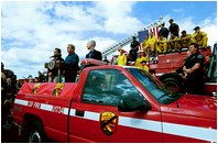 President Bush stands with California Governor-elect Arnold Schwarzenegger, left, and California Governor Gray Davis as he addresses off-duty firefighters and volunteers in El Cajon, Calif., Nov. 4, 2003.