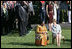 Mrs. Laura Bush and Ghana's first lady Theresa Kufuor sit together on the South Lawn of the White House during the South Lawn Arrival Ceremony Monday, Sept. 15, 2008, on the South Lawn of the White House.