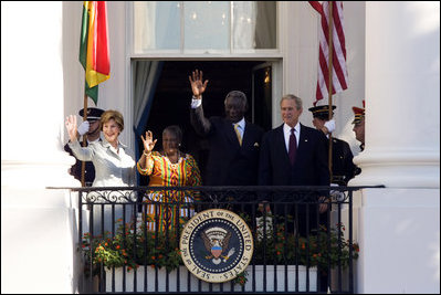 President George W. Bush and Mrs. Laura Bush, joined by President John Agyekum Kufuor and Mrs. Theresa Kufuor of Ghana, acknowledge the crowd Monday, Sept. 15, 2008, following the South Lawn Arrival Ceremony for President Kufuor and Mrs. Kufuor of Ghana at the White House.