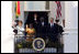 President George W. Bush and Mrs. Laura Bush, joined by President John Agyekum Kufuor and Mrs. Theresa Kufuor of Ghana, acknowledge the crowd Monday, Sept. 15, 2008, following the South Lawn Arrival Ceremony for President Kufuor and Mrs. Kufuor of Ghana at the White House.