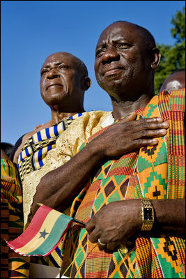 Guests in traditional Ghanaian dress stand for the playing of the national anthems Monday, Sept. 15, 2008, during the South Lawn Arrival Ceremony for President John Agyekum Kufuor of Ghana at the White House.