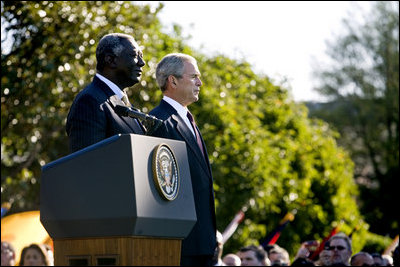 President George W. Bush stands with President John Agyekum Kufuor of Ghana Monday, Sept. 15, 2008, during a South Lawn Arrival Ceremony for the African leader at the White House.