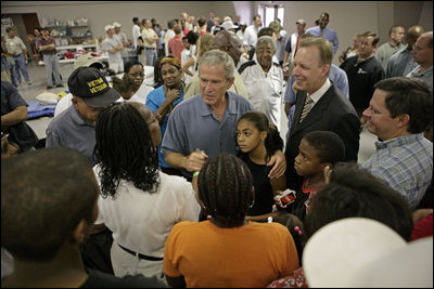 President George W. Bush meets one-on-one with many hurricane survivors at a shelter established at Bethany World Prayer Center during his visit to Baton Rouge, La., Sept. 5, 2005.