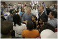 President George W. Bush meets one-on-one with many hurricane survivors at a shelter established at Bethany World Prayer Center during his visit to Baton Rouge, La., Sept. 5, 2005.