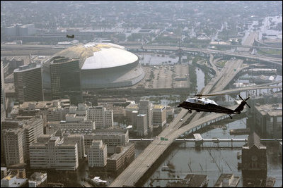 Flying over the Superdome aboard Marine One, President George W. Bush surveys the flooding of New Orleans Sept. 2, 2005. 