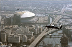 Flying over the Superdome aboard Marine One, President George W. Bush surveys the flooding of New Orleans Sept. 2, 2005. 