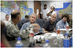 President George W. Bush receives a briefing from U.S. Army Lt. General Russel Honore, left, inside the Emergency Operations Center in Baton Rouge, La., Monday Sept. 5, 2005, as Homeland Security Secretary Michael Chertoff, second from right, and Louisiana Governor Kathleen Blanco, right, participate the meeting. 