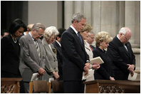 President George W. Bush bows his head in prayer during the National Day of Prayer and Remembrance Service at the Washington National Cathedral in Washington, D.C., Friday, Sept. 16, 2005. Also pictured are Laura Bush, Lynne Cheney Vice President Cheney, Secretary Rice and Secretary Rumsfeld. 