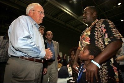 Vice President Dick Cheney visits with families who have been relocated from their homes in Louisiana and Mississippi to the Austin Convention Center in Austin, Texas Saturday, September 10, 2005. The Convention Center has been designated as one of the many temporary shelters for Katrina Hurricane evacuees. 