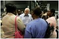 Vice President Dick Cheney visits with families who have been relocated from their homes in Louisiana and Mississippi to the Austin Convention Center in Austin, Texas Saturday, September 10, 2005. The Convention Center has been designated as one of the many temporary shelters for Katrina Hurricane evacuees. 