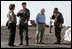 Vice President Dick Cheney and Governor Kathleen Blanco talk with members of the US Army Corp of Engineers during a tour of the 17th street levee repair operations in New Orleans, Louisiana Thursday, September 8, 2005. The Vice President's tour of the city includes visits with police and EMS personnel working in the area.