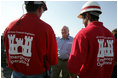 Vice President Dick Cheney speaks with members of the US Army Corps of Engineers personnel while taking a tour of the 17th Street levee repair operations in New Orleans, Louisiana Thursday, September 8, 2005.
