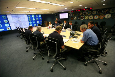 President George W. Bush, joined by Federal Emergency Management Agency Administrator David Paulison, right, and Deputy Administrator Harvey Johnson, left, participates in a briefing on preparations for Hurricane Gustav, at the FEMA National Response Center, Sunday, August 31, 2008 in Washington, DC.