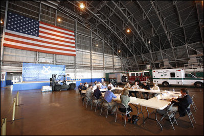 President George W. Bush attends a briefing inside an aircraft hanger Monday, Sept. 1, 2008, at Lackland Air Force Base in San Antonio, Texas, for the latest update on reponse preparation for Hurricane Gustav.